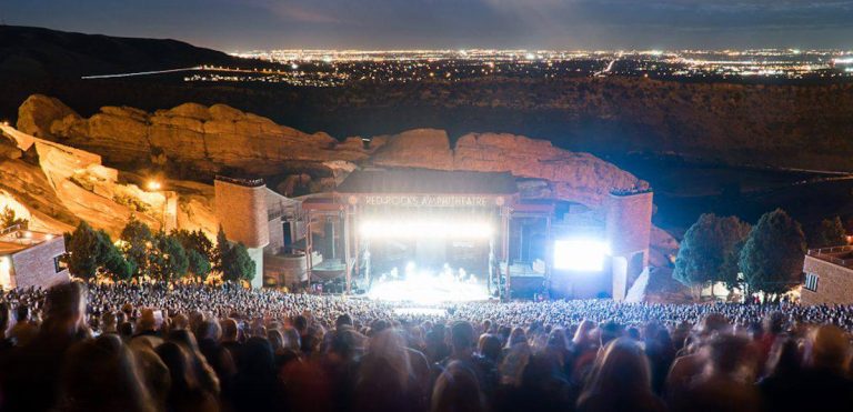 A crowd watching a performance at Red Rocks Amphitheatre.