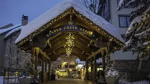 Beaver Creek Resort entrance at night with private shuttle service by Town to Mountain Express.