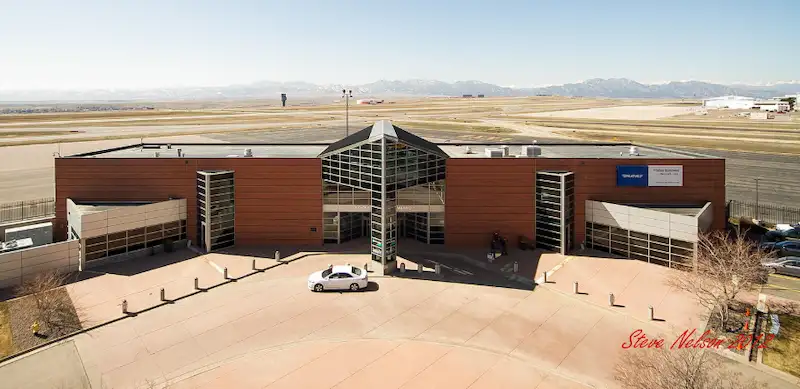 Rocky Mountain Airport (BJC) sign with Town to Mountain Express shuttle service