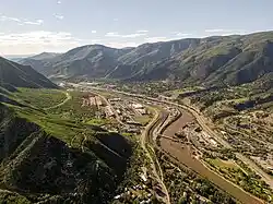 Aerial View of Glenwood Springs Shuttle Tour | Town to Mountain Express Denver Airport Shuttle Drone photo of Glenwood Springs cityscape