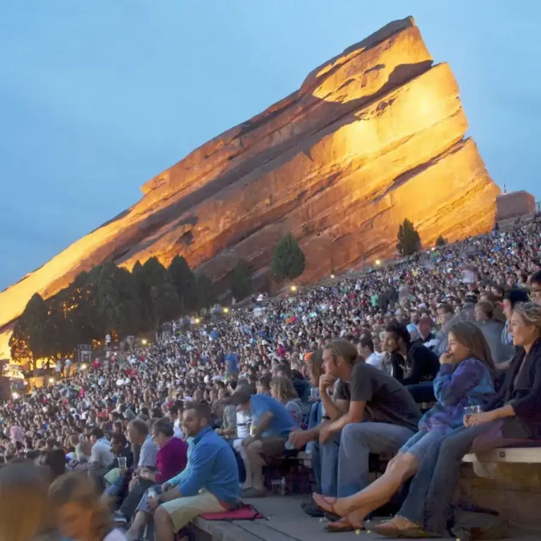Concertgoers beneath the sandstone formations at Red Rocks Amphitheatre.