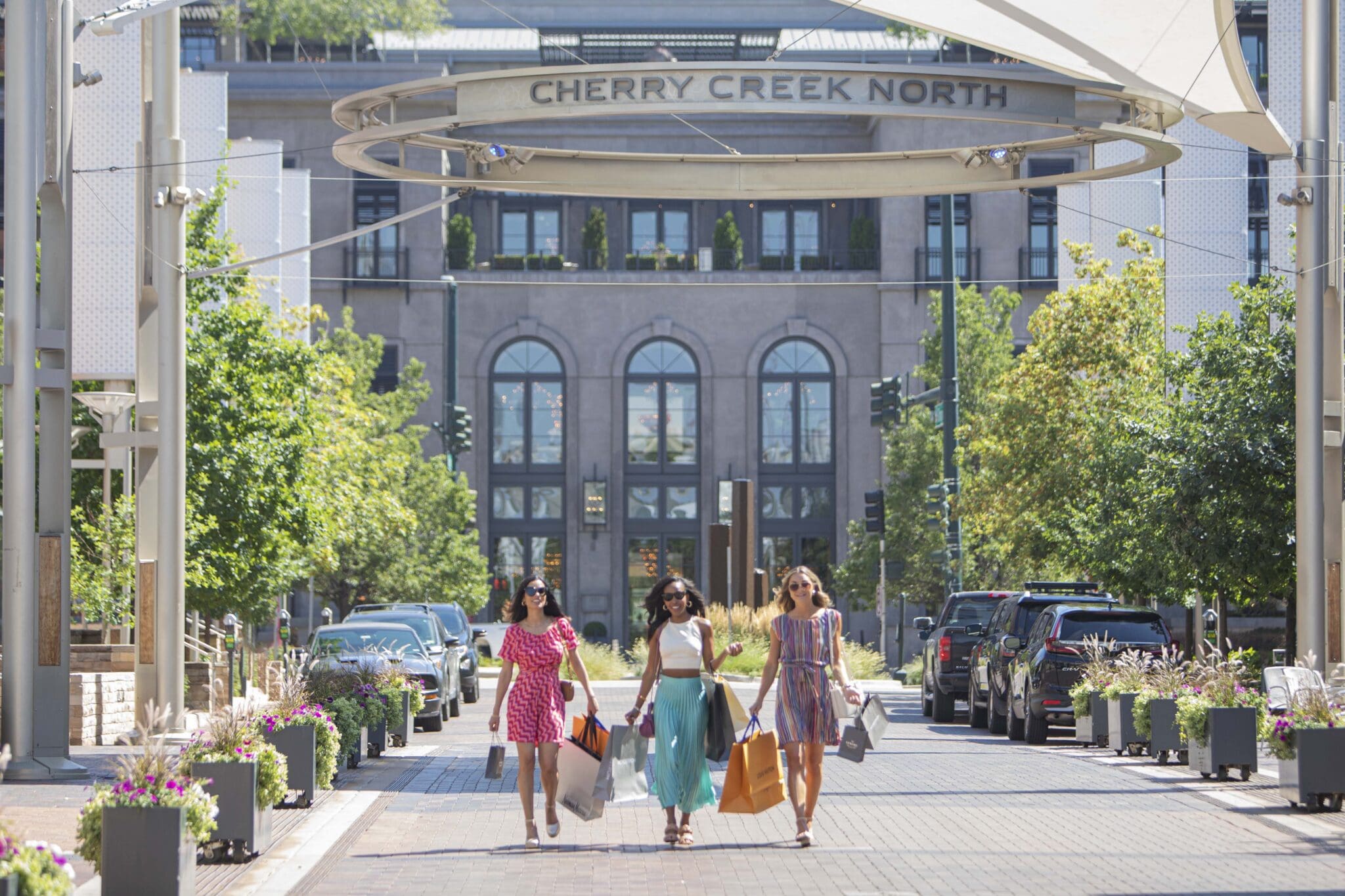 Cherry Creek North neighborhood sign | Town to Mountain Express Denver Airport Shuttle | Town to Mountain Express Denver Airport Shuttle Cherry Creek North sign over a neighborhood shopping street in Denver